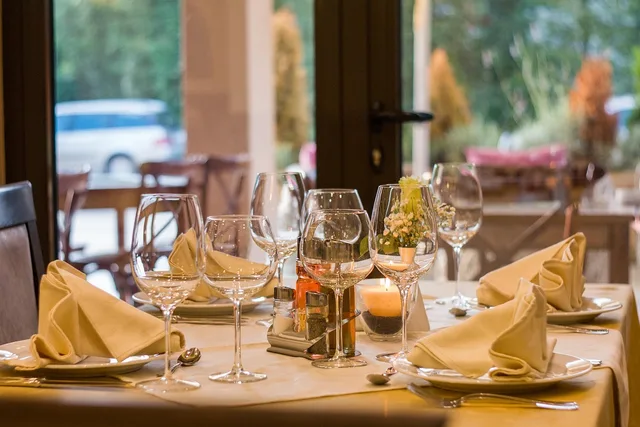 restaurant, table setting, table, glassware, stemware, wine glasses, glasses, plates, napkin, set-up, dinner, dining, service, lunch, restaurant, restaurant, restaurant, restaurant, restaurant. How to size food influencers' partnerships in England